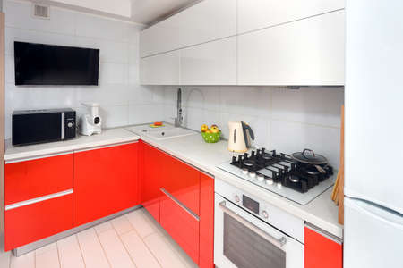 Upscale Maple Red and Smoky White kitchen in luxury home with stoneware counter top flat wooden panels design.の写真素材