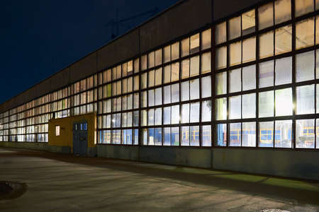 Night panorama of chemical plant building with dark blue sky. Compression buildings receding perspective with copyspace.の写真素材