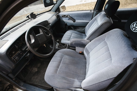 GRODNO, BELARUS - January 2018: Volkswagen Passat B3 GT 1.8 Volkswagen Passat, cockpit interior details gray cabin interior design car passenger and driver seats with seats belt.のeditorial素材