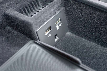 Contemporary car interior element inside of driver seat headrest usb and aux inputs for connecting gadgets to car multimedia system and for charging mobile phones and devices with copyspace.の写真素材