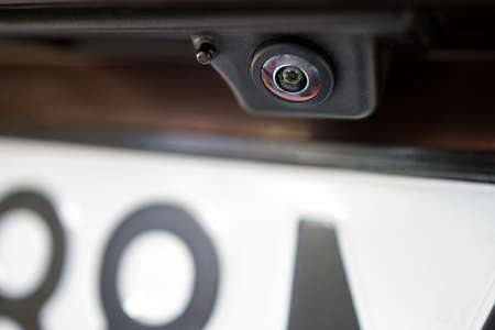 Luxury back car rear view camera close up for parking assistance. Concept of safety car driving while parking process. Assist device equipment in modern carsの写真素材