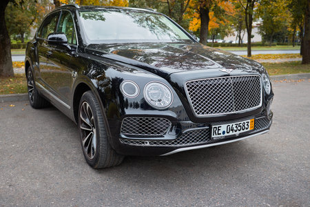 BERLIN, GERMANY - OCTOBER 2020: Bentley Bentayga Hybrid SUV luxury car three fourth right side view outdoors parked on streets of Berlin in fall.のeditorial素材