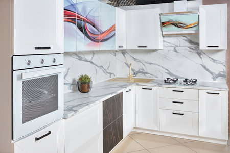 Massive white brushed oak cottage urban rustic loft style kitchen interior in wooden finish and granite stoneware with colorful abstract pattern.の写真素材