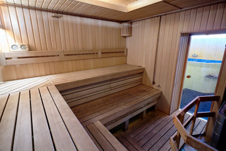 Russian sauna wooden bathhouse with stove and glass door to font. Bath and sauna are good means of preventing disorders of cardiovascular and respiratory systems.の写真素材
