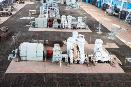 GRODNO, BELARUS - MAY 2020: Compression department machinery. Example of chemical industrial interior. Two high pressure nitrogen turbine compressors of nitrogen fire extinguishing system.のeditorial素材