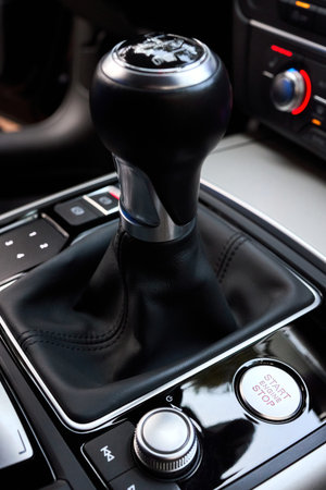 Modern luxury interior start stop engine button shift gear of manual gearbox and Multi Media...