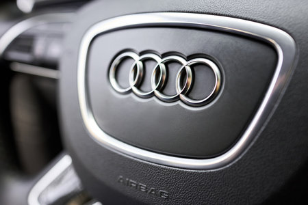 GRODNO, BELARUS - DECEMBER 2019: Audi A6 4G C7 car icon on steering wheel and airbag selective focus. Safety driving concept.のeditorial素材