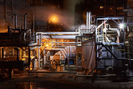 Novomoskovsk, Russia - February 2021: Petrochemical plant in night. Ammonia synthesis complex. Long exposure selective focus photography.の写真素材