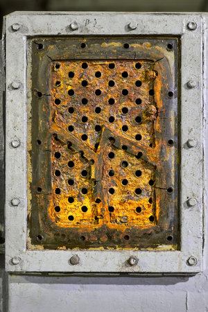 Tube sheet plate of pump three-way heat exchanger or boiler closeup texture macro background full of cracks insoluble hard mineral deposits salts scale and corrosion. Trypophobia concept backgroundの写真素材