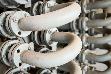 Chemical plant interior with equipment. Double Pipe Heat Exchanger or hairpin heat exchanger with longitudinal fins as an example of simplest form just pipe inside another larger pipe.の写真素材