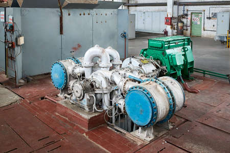 Chemical enterprise interior with equipment. Oxygen compressor for supplying workshops and departments of chemical plant with oxygen for further petrochemical synthesis and reactions.の写真素材