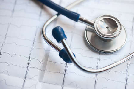 Medical concept. Cardiogram with stethoscope selective focus closeup background with copyspace.の写真素材