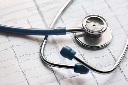 Medical healthcare concept. Cardiogram with stethoscope selective focus closeup background with copyspace.の写真素材