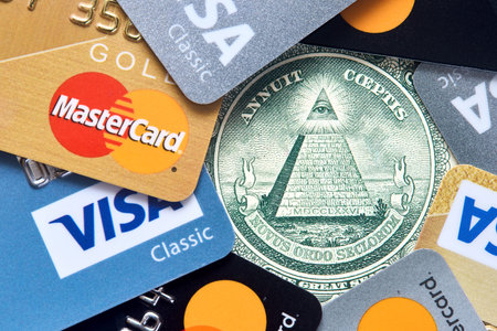 Grodno, Belarus - April 2021: Conspiracy theory of cashless payments concept. All Seeing Eye and...