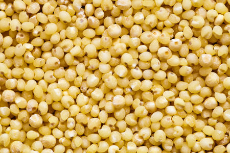 Couscous raw background. Dried couscous seeds closeup flat food texture background. Concept of vegetarianism and healthy eating.の写真素材