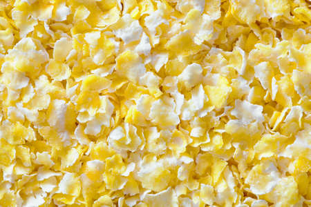 Corn grits groats texture maize meal closeup top view flat closeup background. Concept of healthy eating protein diet and vegetarianism.の写真素材
