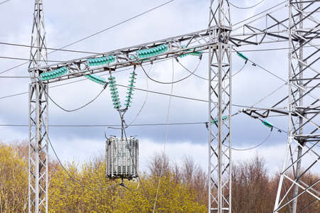 Substation line trap electric communication or high frequency stopper, maintenance-free parallel resonant circuit. Metal constructions and pylons, wires, high voltage electric glass insulators.の写真素材