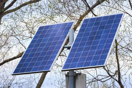 Solar battery generates clean green energy for lanterns in public park closeup. Concept of...