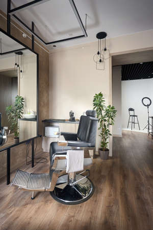 Barber shop or barbershop vintage interior design hair man salon empty with chair and photo studio. Vertical shot.の写真素材