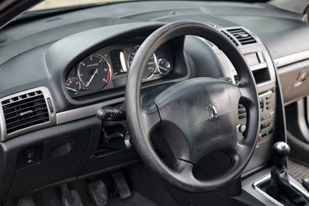 Berlin - April 2014: Peugeot 407 2003-2010 sedan pre facelift interior dashboard cockpit steering wheel and mechanic manual transmission gearbox.のeditorial素材