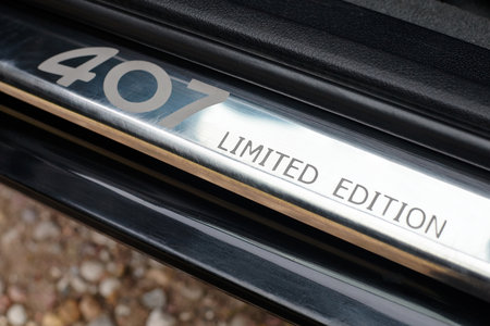 Berlin - April 2014: Peugeot 407 2003-2010 sedan facelift selected focus digit number logo sign of Peugeot 407 Limited Edition car on doorstep threshold. Rare badge of Peugeot Limited Edition series.のeditorial素材