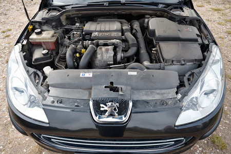 Berlin - April 2014: Peugeot 407 2003-2010 sedan pre facelift closeup engine front view. Internal combustion engine, car parts, detailing.のeditorial素材
