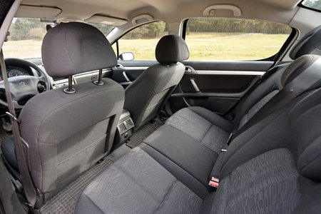 Berlin - April 2014: Peugeot 407 2003-2010 sedan pre facelift contemporary car cabin interior with rear back passenger textile seats with headrests and safety beltsのeditorial素材