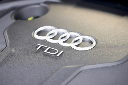 GRODNO, BELARUS - DECEMBER 2019: Audi A6 4G, C7 2.0 TDI 190 Hp 2016 Audi TDI sign logo on diesel motor compartment of modern luxury car with copyspace and sunflare.のeditorial素材