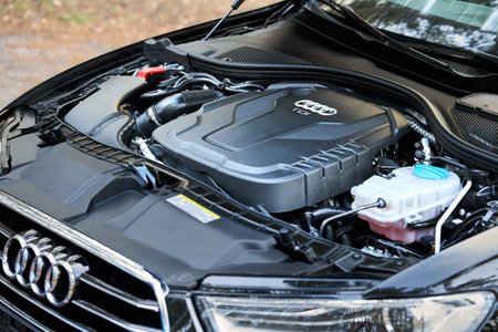 GRODNO, BELARUS - DECEMBER 2019: Audi A6 4G, C7 2.0 TDI 190 Hp 2016 diesel motor compartment of modern luxury car closeup engine left side view. Internal combustion engine, car parts, detailing.のeditorial素材