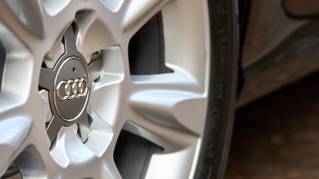 GRODNO, BELARUS - DECEMBER 2019: Audi A6 4G C7 Luxury car closeup alloy wheel part side view with titanium look matt finish 16x9.のeditorial素材