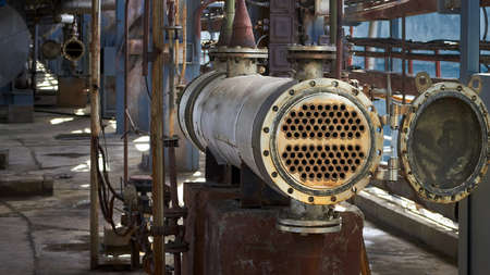 Industrial heat exchanger or boiler tubes bundle. Two way heat exchanger shell and tubes opened for repairing and deposits cleaning at petrochemical enterprises industrial background with copyspace.の写真素材