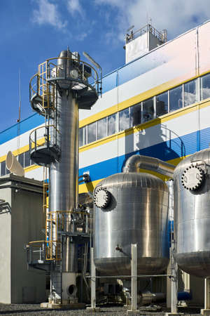 Petrochemical industrial architecture. Liquid oxygen nitrogen and air cryogenic industrial production building and equipment with scrubbers and adsorbers outdoors with copyspace vertical.の写真素材
