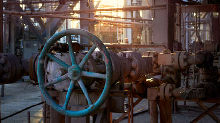 Retro design industrial high pressure angle valve with reducer red handwheel over industrial pipeline background of petrochemical plant methanol enterpriseの写真素材