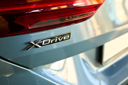 Berlin - October 2021: BMW 8 Series G16 Gran Coupe 840i xDrive M-pack 2021. Back view selective focus car detailing with trunk lid, xDrive logo, badge, emblem.のeditorial素材