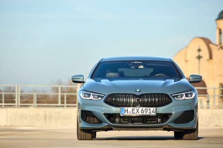 Berlin - October 2021: BMW 8 Series G16 Gran Coupe 840i xDrive M-pack 2021. Front view selective focus over urban background with temple under blue sky with copyspace.のeditorial素材