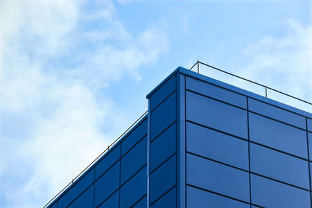 Aluminum composite panels for repair restore facade of commercial building blue corner construction with lightning protection system outdoor wide angle with copyspace conceptual minimalism.の写真素材