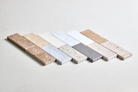 Porcelain ceramic stoneware samples laid on kitchen stoneware table as examples of future kitchen...