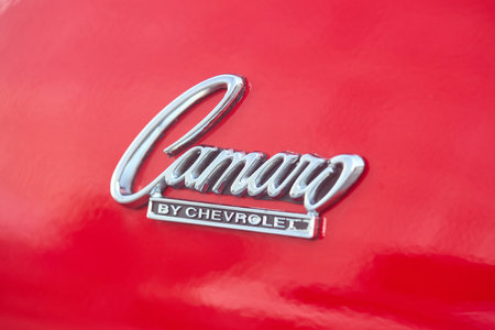 Berlin - August 2022: red vintage retro oldtimer Chevrolet Camaro SS 350 back side chrome emblem sign logo close upのeditorial素材