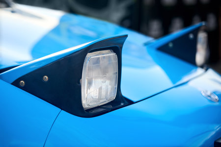 Berlin - August 2022: Toyota MR2 Hidden headlamps, pop-up headlamps, pop-up headlights, flip-eye headlamps or hideaway headlights closeup selective focus on out of focus background with copyspace.のeditorial素材