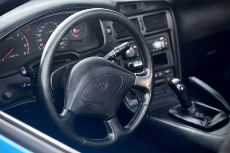 Berlin - August 2022: Toyota MR2 interior dashboard cockpit steering wheel and mechanic manual transmission gearbox.のeditorial素材