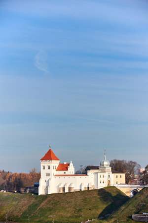 Grodno, Belarus - October 2021: Grodno Old castle on Castle Hill, an ancient oldest royal Castle of Belarus and church, historical monument. Building exterior in autumn Grodno Hrodna Belarus vertical.のeditorial素材
