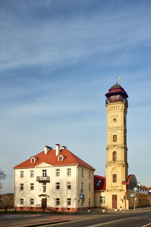 Berlin - October 2021: History museum of MODERN fire service and lookout fire tower nineteenth century architecture building under blue sky in Grodno Hrodna Belarus old european city with copyspace.のeditorial素材