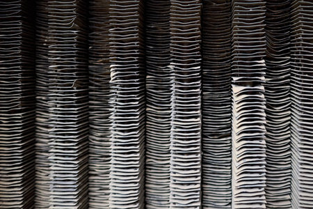 Plate-fin heat exchanger surface closeup texture. Old heat exchange equipment bent plates with traces of corrosion rust. Selective focus industrial background, with copyspace.の写真素材