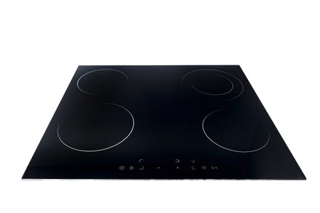 Flat cooktop cooking induction electric built black stove. Electric induction hob with ceramic tempered glass surface with white burners and touch control buttons panel, isolated on white.の写真素材