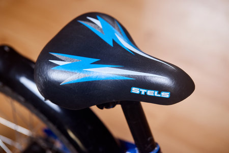 Berlin - May 2023: children bicycle Stels ergonomic comfortable black seat closeup selective focus shot.のeditorial素材