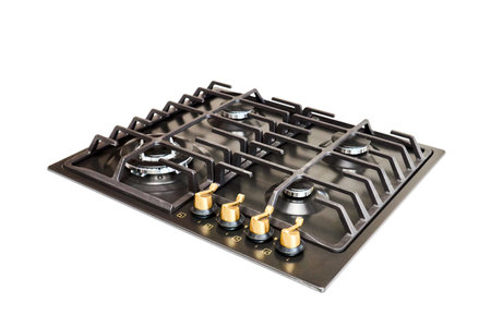 Modern gas hob stove made of steel and cast iron with golden controls using natural gas or propane for cooking products, isolated on white background.の写真素材