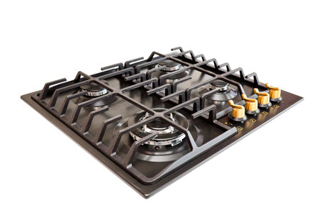 Modern gas hob stove made of steel and cast iron with golden controls using natural gas or propane for cooking products, isolated on white background.の写真素材