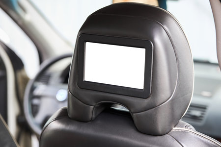 Car inside headrest screen mock up. Interior of prestige luxury modern car. One white display for...