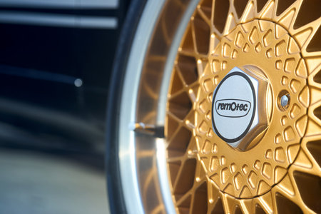 Berlin, Germany - August 20, 2022: Remotec high performance alloy wheel closeup rim detailing with RemOtec logo cup selective focus shot with copyspace.のeditorial素材