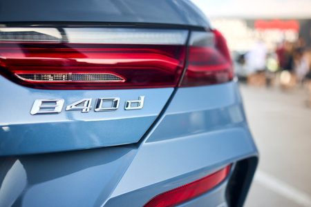 Berlin, Germany - August 20, 2022: BMW 8 Series G16 Gran Coupe 840d xDrive M-package. Car detail 840d rear badge logo emblem selective focus closeup with taillight bumper out of focus background.のeditorial素材